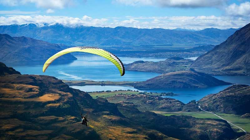 Experience an exhilarating big mountain paragliding flight with stunning views of Lake Wanaka!
